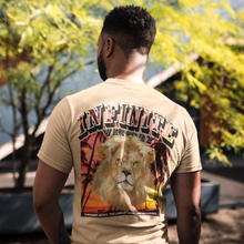 Load image into Gallery viewer, "INFINTIE VICTORY THROUGH JESUS CHRIST" TEE | FRONT CORNER ARCH + BACK (SAND)
