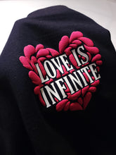 Load image into Gallery viewer, "LOVE IS INFINITE" V-DAY BLACK HOODIE | FRONT + BACK (3D PUFF/GLOW IN THE DARK)